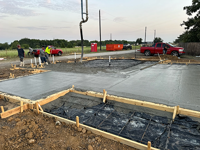 Concrete foundation being poured