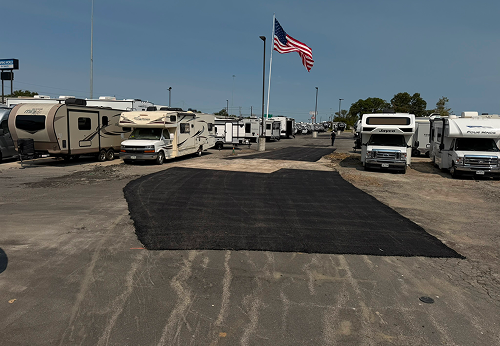 Pothole repair in an asphalt parking lot