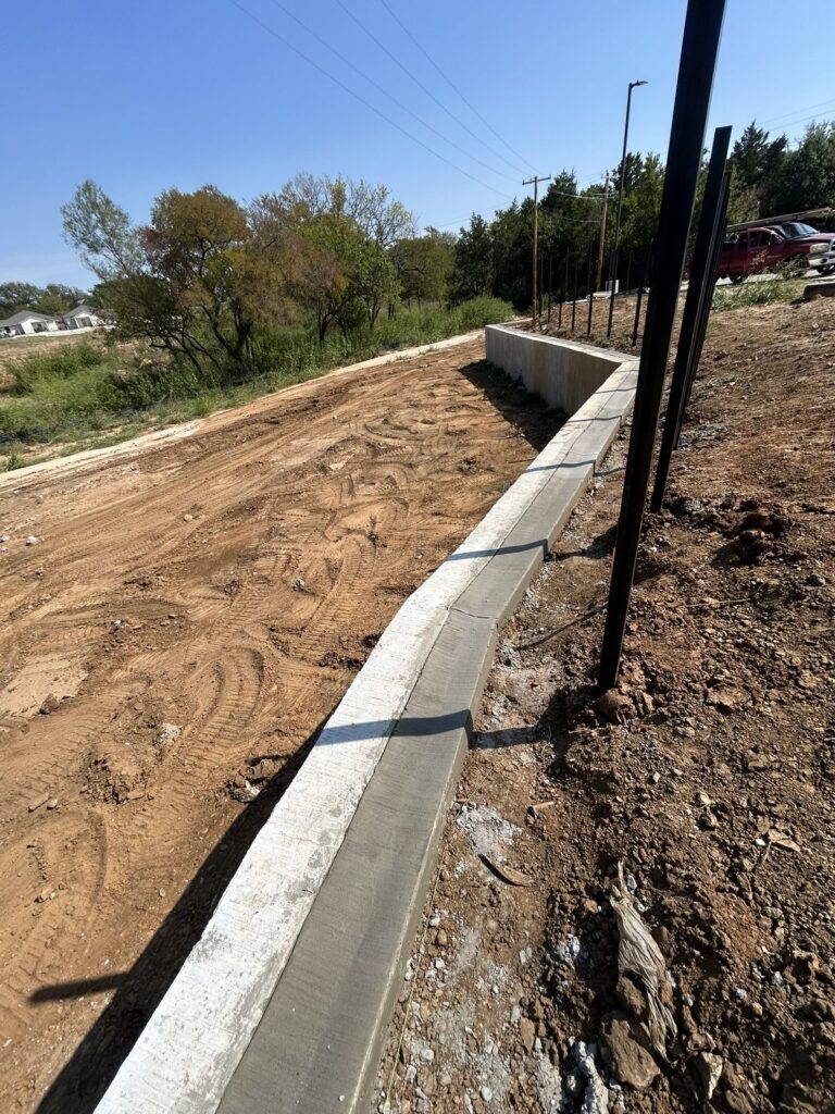 Concrete drainage flume along a slope on US Hwy 75 in Denison, TX