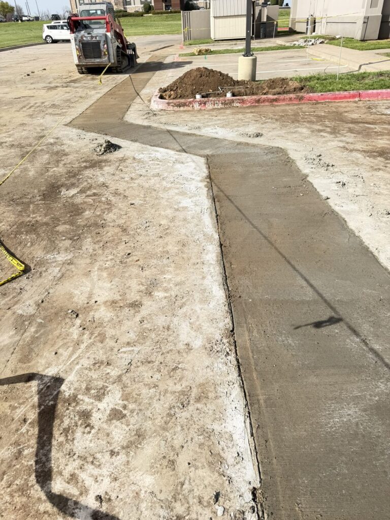 Concrete patch poured through a restaurant parking lot in Denison, TX