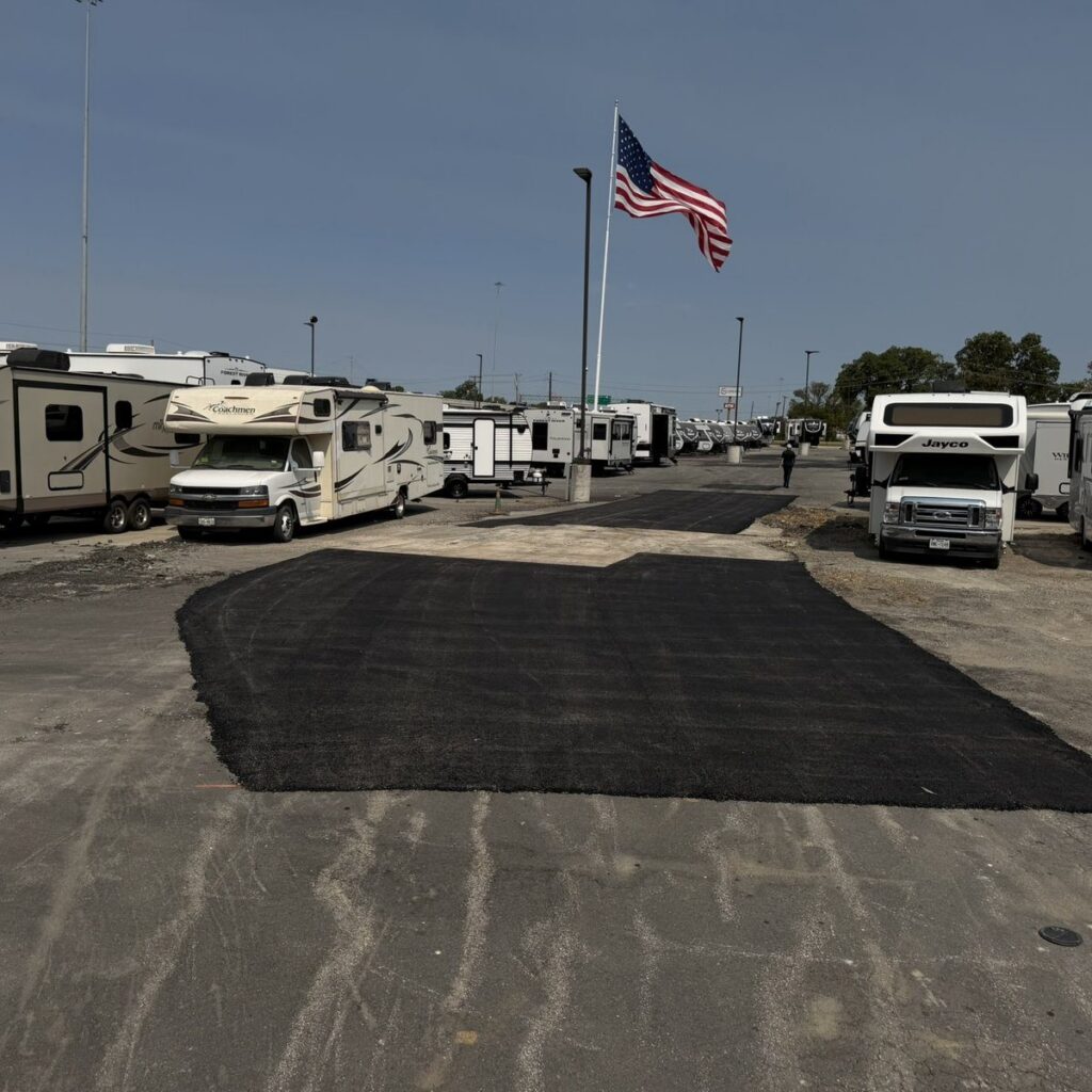 Asphalt patch repair in an RV dealership lot in Sherman, TX