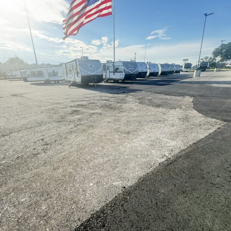 Asphalt patch along a drive lane at an RV dealership in Sherman, TX